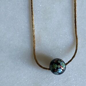 Elegant Gold  Tone Necklace with Black  Glass Floral Bead Pendant